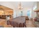 An open-concept living room features a pool table and a stone fireplace at 296 Beavers Rd, Grantville, GA 30220