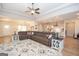 Open concept living room with a large sectional, modern decor, and seamless flow to the kitchen at 296 Beavers Rd, Grantville, GA 30220