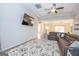 Comfortable living room with a large sectional sofa, stylish rug, and bright natural light at 296 Beavers Rd, Grantville, GA 30220