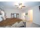 Spacious main bedroom with a ceiling fan and access to the ensuite bathroom at 296 Beavers Rd, Grantville, GA 30220