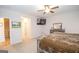 Spacious main bedroom with ceiling fan and view to an attached media room at 296 Beavers Rd, Grantville, GA 30220