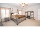 Spacious main bedroom featuring a decorative ceiling fan and large windows at 296 Beavers Rd, Grantville, GA 30220
