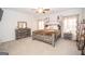 Spacious main bedroom featuring a decorative ceiling fan and large windows at 296 Beavers Rd, Grantville, GA 30220