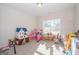 Spacious ' room featuring bright natural light and plush carpeting. Ready for play! at 296 Beavers Rd, Grantville, GA 30220