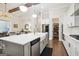 Modern kitchen with stainless steel appliances, a center island, and a walk-in pantry at 114 Village Green Ave, Woodstock, GA 30189