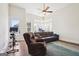 Living room featuring a comfortable leather sofa, recliner and exercise equipment at 114 Village Green Ave, Woodstock, GA 30189