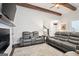 Cozy living room with comfortable seating, a fireplace, and hardwood floors at 114 Village Green Ave, Woodstock, GA 30189