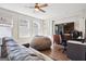 Spacious living room featuring a sofa, an oversized beanbag chair, and a large TV at 114 Village Green Ave, Woodstock, GA 30189