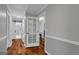 Hallway view showing doors to other rooms and hardwood flooring at 2716 Georgia 16, Carrollton, GA 30116