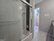 Bathroom featuring a modern shower with glass doors and a tiled interior at 5447 Ahyoka Dr, Morrow, GA 30260