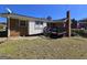 Exterior shot of the brick home with a deck and generous yard space at 5447 Ahyoka Dr, Morrow, GA 30260