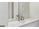 Modern bathroom featuring a white countertop and a brushed-nickel faucet, creating a clean and stylish look at 2589B Se Fieldstone View Ln, Conyers, GA 30013