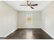 Inviting bedroom with modern ceiling fan and dark wood floors offers a comfortable and serene space at 2589B Se Fieldstone View Ln, Conyers, GA 30013