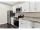 Newly remodeled kitchen featuring stainless steel appliances and granite countertops at 2589B Se Fieldstone View Ln, Conyers, GA 30013