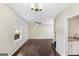 Bright living room featuring hardwood floors, a ceiling fan, and natural light at 2589B Se Fieldstone View Ln, Conyers, GA 30013