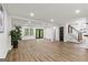 Finished basement features wood-look flooring, recessed lighting, and a staircase at 125 Marilyn Ct, Fayetteville, GA 30214