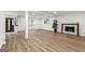 Bright, finished basement with wood-look flooring, recessed lighting, and a modern fireplace at 125 Marilyn Ct, Fayetteville, GA 30214