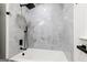 Stylish bathroom featuring a tub with luxurious tile surround and modern black fixtures at 125 Marilyn Ct, Fayetteville, GA 30214