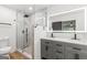 Modern bathroom with a walk-in shower, dual vanity, and sleek fixtures at 125 Marilyn Ct, Fayetteville, GA 30214