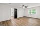 Bright and airy bedroom with natural light, ceiling fan, and a closet with a black door at 125 Marilyn Ct, Fayetteville, GA 30214