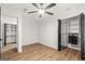 This bedroom includes closet, ceiling fan, updated floors and adjacent closet storage at 125 Marilyn Ct, Fayetteville, GA 30214