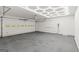 Spacious garage with ample room for parking and storage, featuring an modern lighting system at 125 Marilyn Ct, Fayetteville, GA 30214