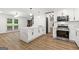 Stylish kitchen boasting a center island with stone countertops, stainless steel appliances, and modern lighting at 125 Marilyn Ct, Fayetteville, GA 30214
