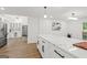 Modern kitchen with a large center island, stainless steel appliances, and sleek white cabinetry at 125 Marilyn Ct, Fayetteville, GA 30214