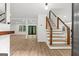 Spacious entryway featuring a modern wood staircase with metal railings and open floorplan at 125 Marilyn Ct, Fayetteville, GA 30214