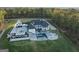 Aerial view of a sprawling estate with a large home, manicured lawn, and pool area at 4100 Oak Hill Rd, Douglasville, GA 30135