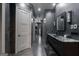 Spacious bathroom hallway featuring stone floors, marble countertops, and modern lighting throughout at 4100 Oak Hill Rd, Douglasville, GA 30135