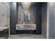 Luxurious bathroom features marble countertops, stylish lighting fixtures, and modern cabinetry for storage at 4100 Oak Hill Rd, Douglasville, GA 30135