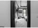 View of the bedroom through the doorway featuring neutral tones and modern decor at 4100 Oak Hill Rd, Douglasville, GA 30135