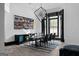 Bright dining room featuring a modern light fixture, sleek furniture, and natural light at 4100 Oak Hill Rd, Douglasville, GA 30135
