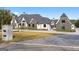 Elegant exterior showcases a brick driveway, manicured lawn, and a stone mailbox at 4100 Oak Hill Rd, Douglasville, GA 30135