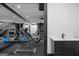 Home gym features ceiling fans, exercise equipment, mirrors, and a gray rubberized floor at 4100 Oak Hill Rd, Douglasville, GA 30135