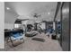 Spacious home gym with multiple workout machines, ample lighting, and modern flooring at 4100 Oak Hill Rd, Douglasville, GA 30135