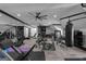 Spacious workout room boasts lots of exercise equipment, recessed lighting, and herringbone floors at 4100 Oak Hill Rd, Douglasville, GA 30135