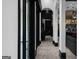Bright hallway featuring an arched entry and sleek black and white design elements at 4100 Oak Hill Rd, Douglasville, GA 30135