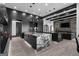 Modern kitchen featuring an island with marble countertops, black cabinets, and contemporary pendant lighting at 4100 Oak Hill Rd, Douglasville, GA 30135