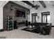 Modern living room boasts an entertainment center, sleek fireplace, large speakers, and luxury seating at 4100 Oak Hill Rd, Douglasville, GA 30135