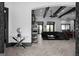 Bright, open-concept living room featuring hardwood floors, beamed ceilings, and modern decor at 4100 Oak Hill Rd, Douglasville, GA 30135