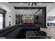 An expansive living room with hardwood floors, a sleek sectional, and elegant modern decor at 4100 Oak Hill Rd, Douglasville, GA 30135