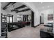 Spacious living room with hardwood floors, beamed ceilings, and a large sectional sofa at 4100 Oak Hill Rd, Douglasville, GA 30135