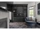 Inviting living room features a built-in bookshelf, cozy chaise lounge and large windows for natural light at 4100 Oak Hill Rd, Douglasville, GA 30135