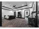 Spacious main bedroom featuring a fireplace, tray ceiling, wet bar, and carpeting at 4100 Oak Hill Rd, Douglasville, GA 30135
