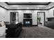 Primary bedroom showcasing fireplace, television, wet bar, and unique bed design at 4100 Oak Hill Rd, Douglasville, GA 30135