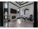 Stylish home office featuring hardwood floors, fireplace, built-in shelving, and modern decor at 4100 Oak Hill Rd, Douglasville, GA 30135