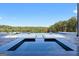 Large pool and integrated hot tub, complemented by meticulously manicured landscaping and a panoramic view at 4100 Oak Hill Rd, Douglasville, GA 30135