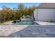 Beautiful backyard pool and patio surrounded by lush landscaping, offering a private oasis at 4100 Oak Hill Rd, Douglasville, GA 30135